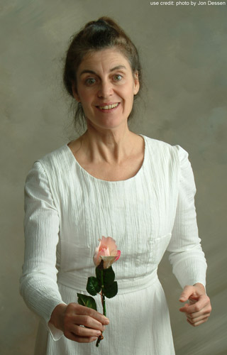 Patricia as Emily Dickinson, with a rose